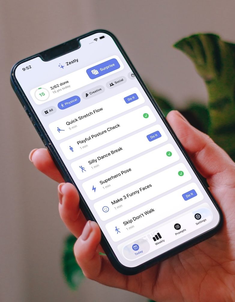 Person holding an iPhone displaying the Zestly app